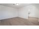 Living room featuring light wood floors and an arched doorway at 3045 Cedar St, Las Vegas, NV 89104