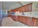 Modern kitchen with wood cabinets, tile backsplash and flooring at 485 Sari Dr, Las Vegas, NV 89110