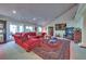 Living Room with red sectional sofa, coffee table, and area rug at 485 Sari Dr, Las Vegas, NV 89110