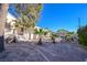 Landscaped yard with palm trees and stone pathway at 485 Sari Dr, Las Vegas, NV 89110