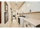 Functional laundry room with washer, dryer, and extra counter space at 53 Stone Yucca Ct, Henderson, NV 89011