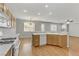 Bright kitchen with island, gas range, and wood cabinets at 542 Halloran Springs Rd, Las Vegas, NV 89148