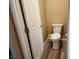 Small bathroom with toilet and wood-look flooring at 6417 Winter Moon St, North Las Vegas, NV 89084