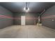 Attached garage with painted walls and floor at 7137 Orion Bands St, Las Vegas, NV 89131