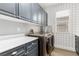 Laundry room with washer, dryer, and ample counter space at 7208 Iron Oak Ave, Las Vegas, NV 89113