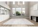 Light-filled living room with built-in shelving and hardwood floors at 7208 Iron Oak Ave, Las Vegas, NV 89113