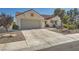 Single-story home with attached garage and driveway at 3100 Angelica Ct, Las Vegas, NV 89134