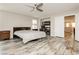 Large main bedroom with wood-look floors and plenty of natural light at 3163 Biccari Ave, Henderson, NV 89044