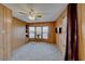 Bright bedroom with a ceiling fan, bay window, and wall-mounted TV at 5473 Aldama Rd, Las Vegas, NV 89122