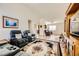 Living room with hardwood floors, comfortable seating, and an entertainment center at 5732 Breezy Wind Ct, North Las Vegas, NV 89081