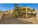 Covered patio with seating area and landscaping at 5732 Breezy Wind Ct, North Las Vegas, NV 89081