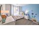 Charming bedroom with playful decor, a comfortable bed, and a desk area at 10040 Ullom Dr, Las Vegas, NV 89141