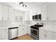 Modern kitchen featuring white shaker cabinets and stainless steel appliances at 1008 Wyatt Ave, Las Vegas, NV 89106