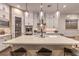 Modern kitchen with white cabinetry, large island, and stylish pendant lighting at 1199 N Water St, Henderson, NV 89011