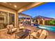 Inviting pool and spa with fire features and covered patio area at 1199 N Water St, Henderson, NV 89011