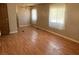 Living room featuring wood-look flooring and neutral walls at 1240 S Comstock Cir, Pahrump, NV 89048