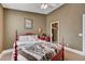 Red, wooden framed bed in a bedroom with a closet and desk at 1785 Lakewood Dr, Henderson, NV 89012