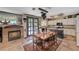 Kitchen with island, dining area, and fireplace at 1785 Lakewood Dr, Henderson, NV 89012