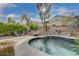 Inviting kidney-shaped pool with a patio and landscaping at 1785 Lakewood Dr, Henderson, NV 89012