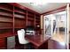 Home office with built-in bookshelves and a large desk at 2104 Stone Croft St, Las Vegas, NV 89134