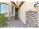 Inviting entryway with stone accents and landscaping at 2128 Delmar Farms Ct, Laughlin, NV 89029