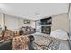 Living room with fireplace, large TV, and comfortable seating at 2749 Brienza Way, Las Vegas, NV 89117