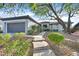 House exterior showcasing walkway and mature trees at 2779 Foxtail Creek Ave, Henderson, NV 89052