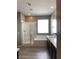 Modern bathroom with a glass shower, soaking tub, and double vanity at 3164 Rowan Brook Ave, Henderson, NV 89052