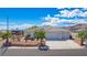 Single-story home with three-car garage and desert landscaping at 3633 Laughlin Blvd, Laughlin, NV 89029