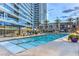 Inviting swimming pool with a spacious deck and comfortable lounge chairs at 4525 Dean Martin Dr # 302, Las Vegas, NV 89103