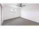 Bright bedroom with grey carpet and ample closet space at 5245 New Bedford Cir, Las Vegas, NV 89122