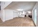 Modern kitchen with white cabinets and a center island, partially visible from living room at 5245 New Bedford Cir, Las Vegas, NV 89122