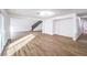 Open living space with hardwood floors and a staircase at 5245 New Bedford Cir, Las Vegas, NV 89122