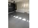 Garage with Tesla logo and epoxy floor at 5896 Lambert Bridge Ave, Las Vegas, NV 89139