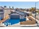 Newly constructed single-story home with a gray garage door and desert landscaping at 6031 Orange Hill Dr, Las Vegas, NV 89142