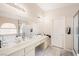 Bathroom with double vanity, soaking tub, and shower at 7074 Sea Orchard St, Las Vegas, NV 89131