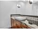 Modern bathroom with dark tile and floating vanity at 8050 Castle Pines Ave, Las Vegas, NV 89113