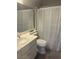 Clean bathroom featuring a toilet, sink, and shower bathtub at 1307 Deer Horn Ln, North Las Vegas, NV 89031