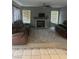 Living room with brown reclining sofas and a fireplace at 1307 Deer Horn Ln, North Las Vegas, NV 89031