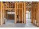 New home interior framing with open concept living area and fireplace at 1487 Reims Dr, Henderson, NV 89012