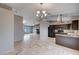 Kitchen with dark brown cabinets, granite countertops, and black appliances at 180 Lido Cir, Henderson, NV 89015