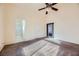 Spacious bedroom with vaulted ceiling, ceiling fan, and carpet flooring at 1904 Leaning Pine Way, Las Vegas, NV 89128