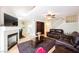 Living room with fireplace, hardwood floors, and view of dining area at 2313 Pacific Creek St, Las Vegas, NV 89117