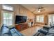 Living room with two leather sofas and a large TV at 479 Paulson Dr, Las Vegas, NV 89123