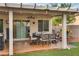 Covered patio with outdoor dining furniture and a pergola at 479 Paulson Dr, Las Vegas, NV 89123