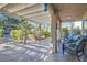 Covered patio with seating area and a water feature in a private backyard at 5205 Sandy Cactus Ln, Las Vegas, NV 89149