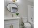 Updated bathroom with white vanity, gold accents, and a walk-in shower at 5345 Rod Ct # 101, Las Vegas, NV 89122