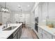 Modern kitchen with white cabinets, large island, and breakfast nook at 1604 Bontemps Ct, Henderson, NV 89052