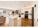 Spacious kitchen with white cabinets, stainless steel appliances, and hardwood floors at 2341 Cordelia St, Henderson, NV 89044