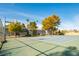 Community tennis court next to a basketball hoop at 265 N Lamb Blvd # D, Las Vegas, NV 89110